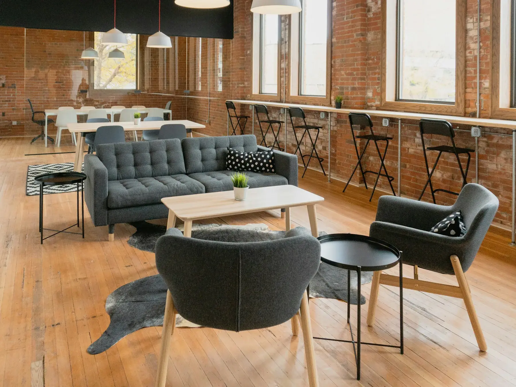 Café lounge with grey sofas and chairs